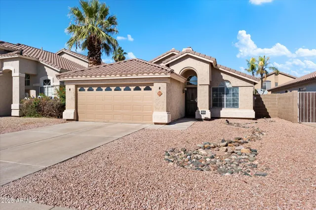 a view of a white house with a outdoor space