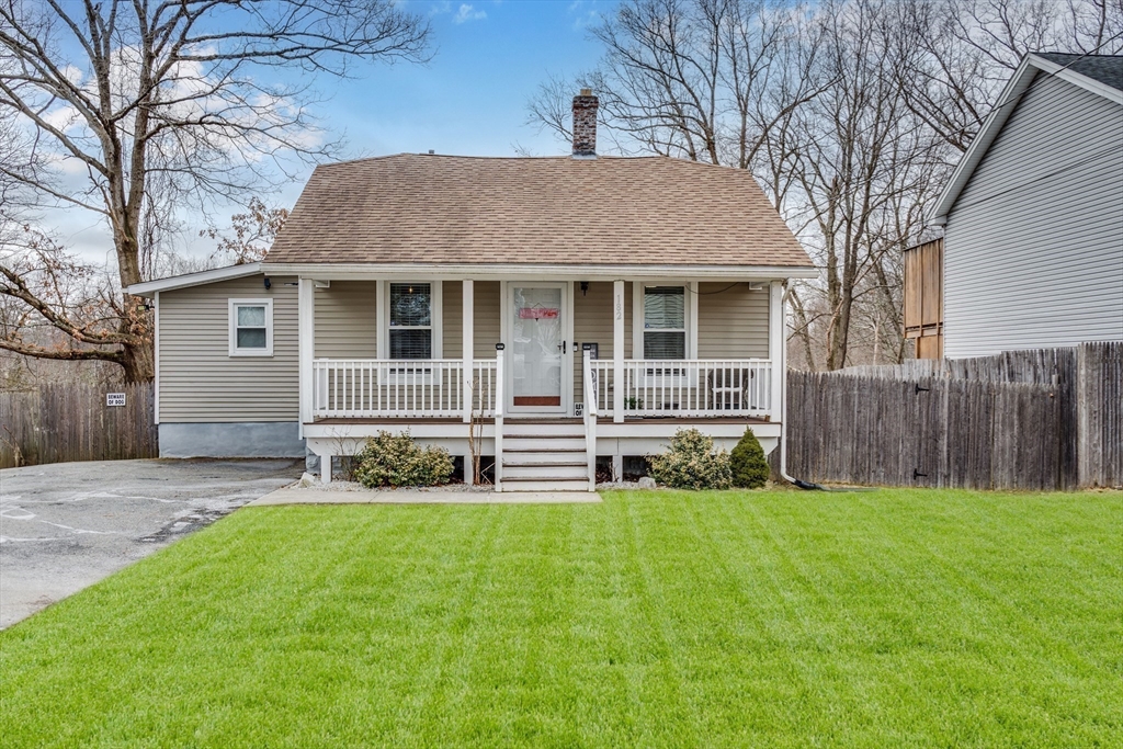 182 Wrentham Road Springfield, MA 01119 - Photo 1 of 25 a front view of house with yard and green space