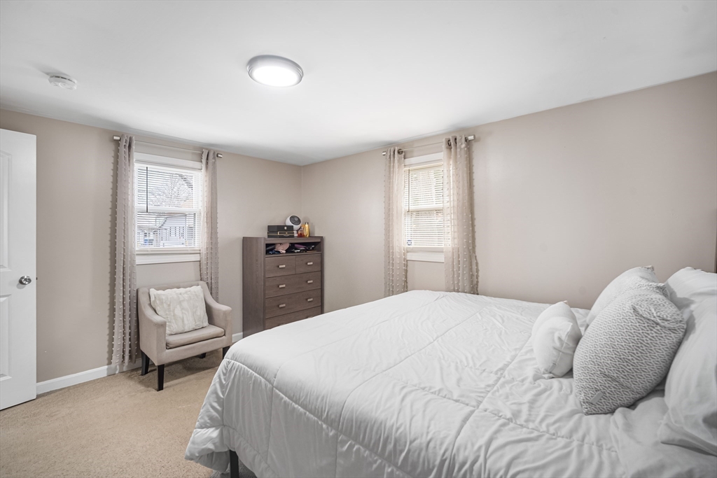 182 Wrentham Road Springfield, MA 01119 - Photo 15 of 25 a bedroom with a bed and a window
