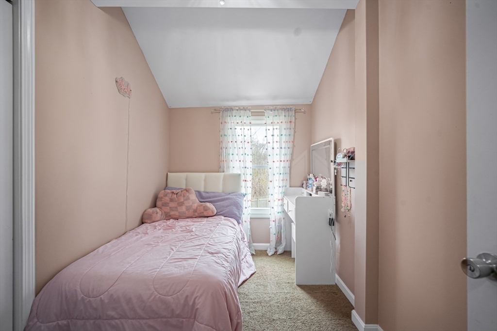 182 Wrentham Road Springfield, MA 01119 - Photo 18 of 25 a bedroom with a bed and a window