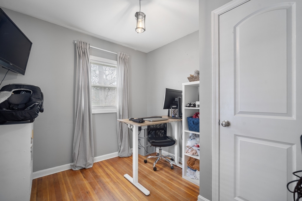182 Wrentham Road Springfield, MA 01119 - Photo 21 of 25 a view of a workspace with furniture and a window