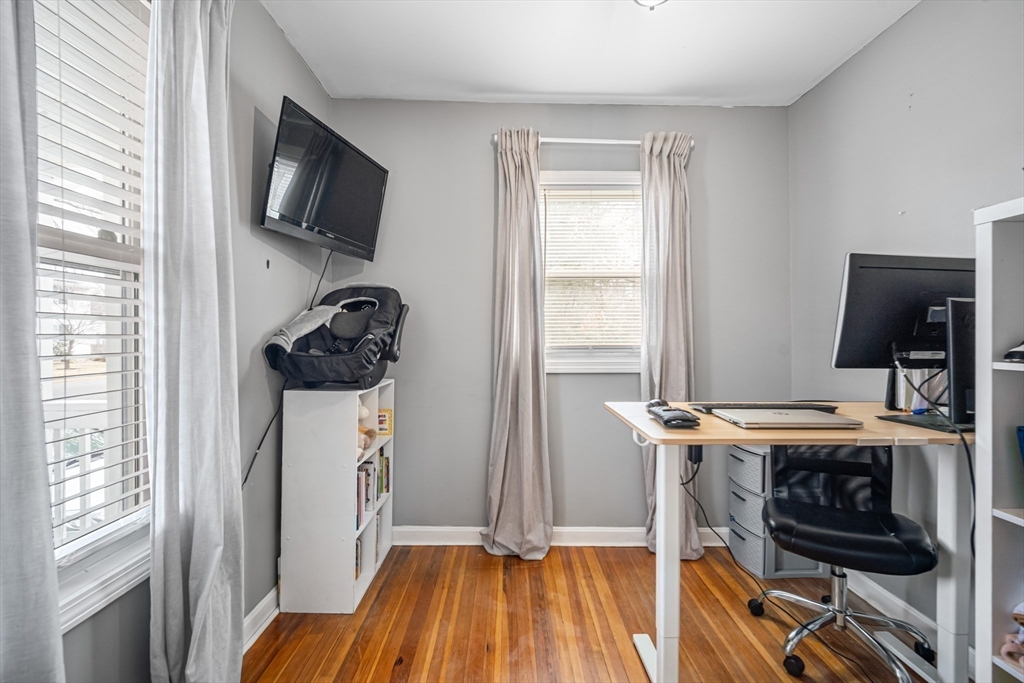 182 Wrentham Road Springfield, MA 01119 - Photo 22 of 25 a view of a workspace with furniture and a window