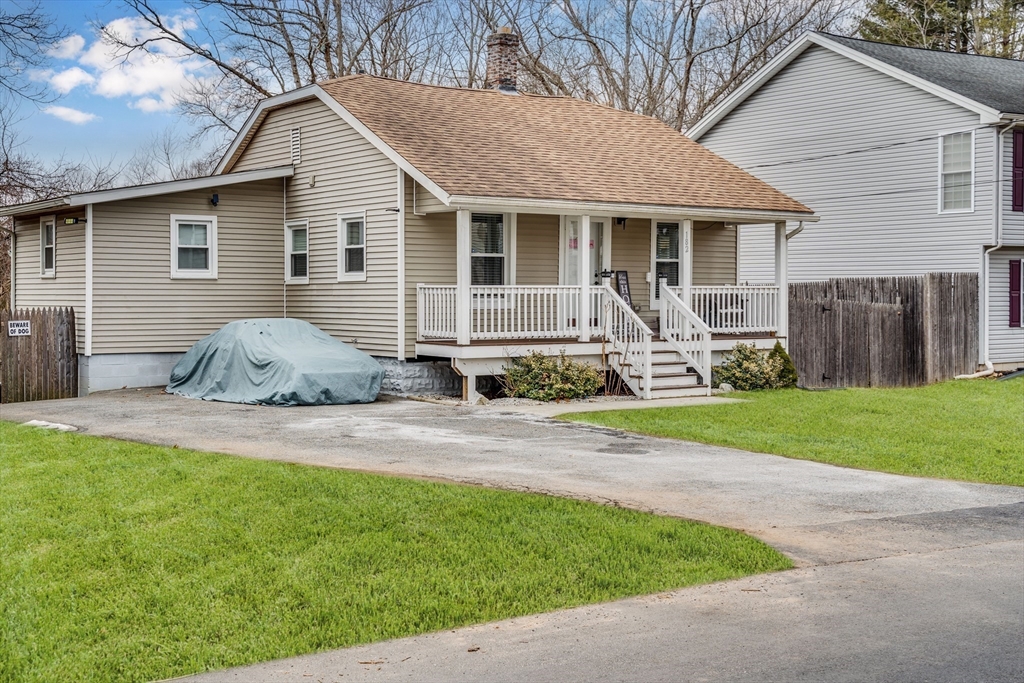 182 Wrentham Road Springfield, MA 01119 - Photo 3 of 25 a front view of house with yard and outdoor seating