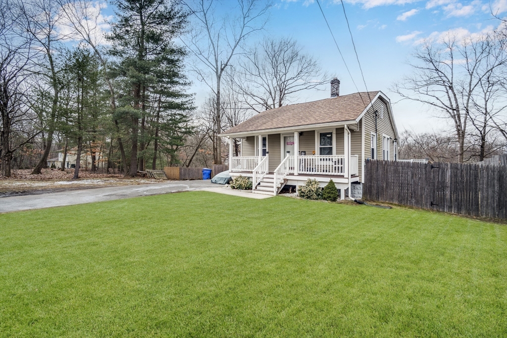 182 Wrentham Road Springfield, MA 01119 - Photo 4 of 25 a front view of house with yard and seating area