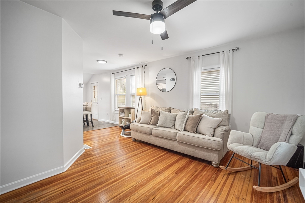 182 Wrentham Road Springfield, MA 01119 - Photo 6 of 25 a living room with furniture and a wooden floor