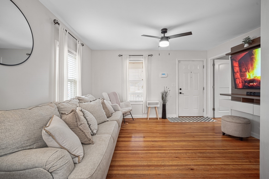 182 Wrentham Road Springfield, MA 01119 - Photo 7 of 25 a living room with furniture and a flat screen tv