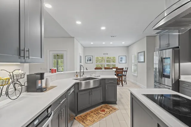 a kitchen with a sink and a refrigerator
