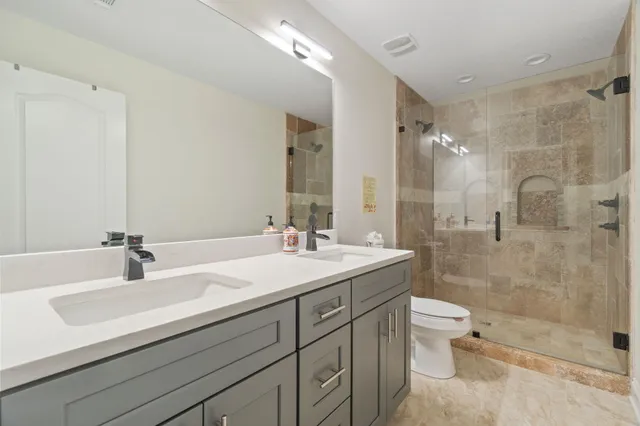 a spacious bedroom with a bed and window