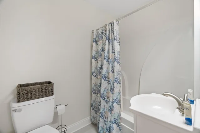 a spacious bedroom with a bed and a large window