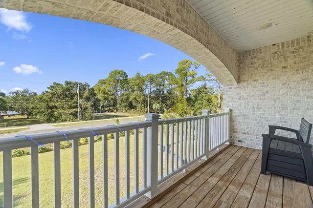 a balcony with trees in front of it