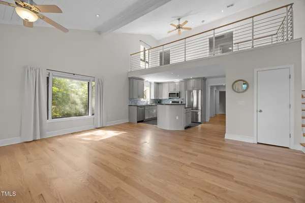 a view of a room that has a table and chairs