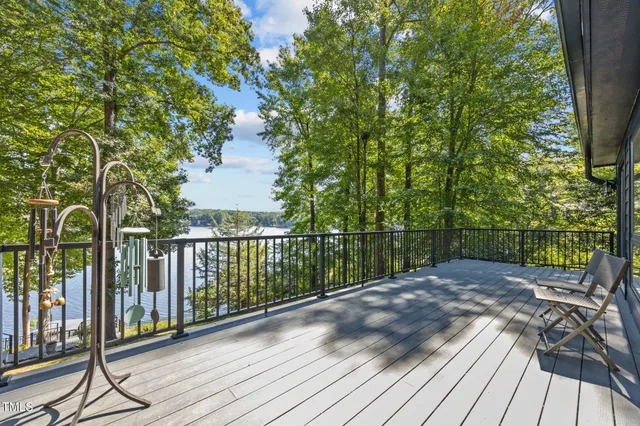 a view of kitchen with sink and refrigerator