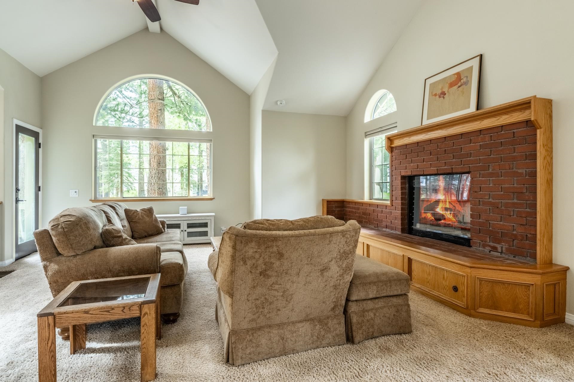 272 Ridge Way Mammoth Lakes, CA 93546 - Photo 11 of 55 Vaulted ceilings highlight a brick fireplace with wood surround and integrated cabinetry
