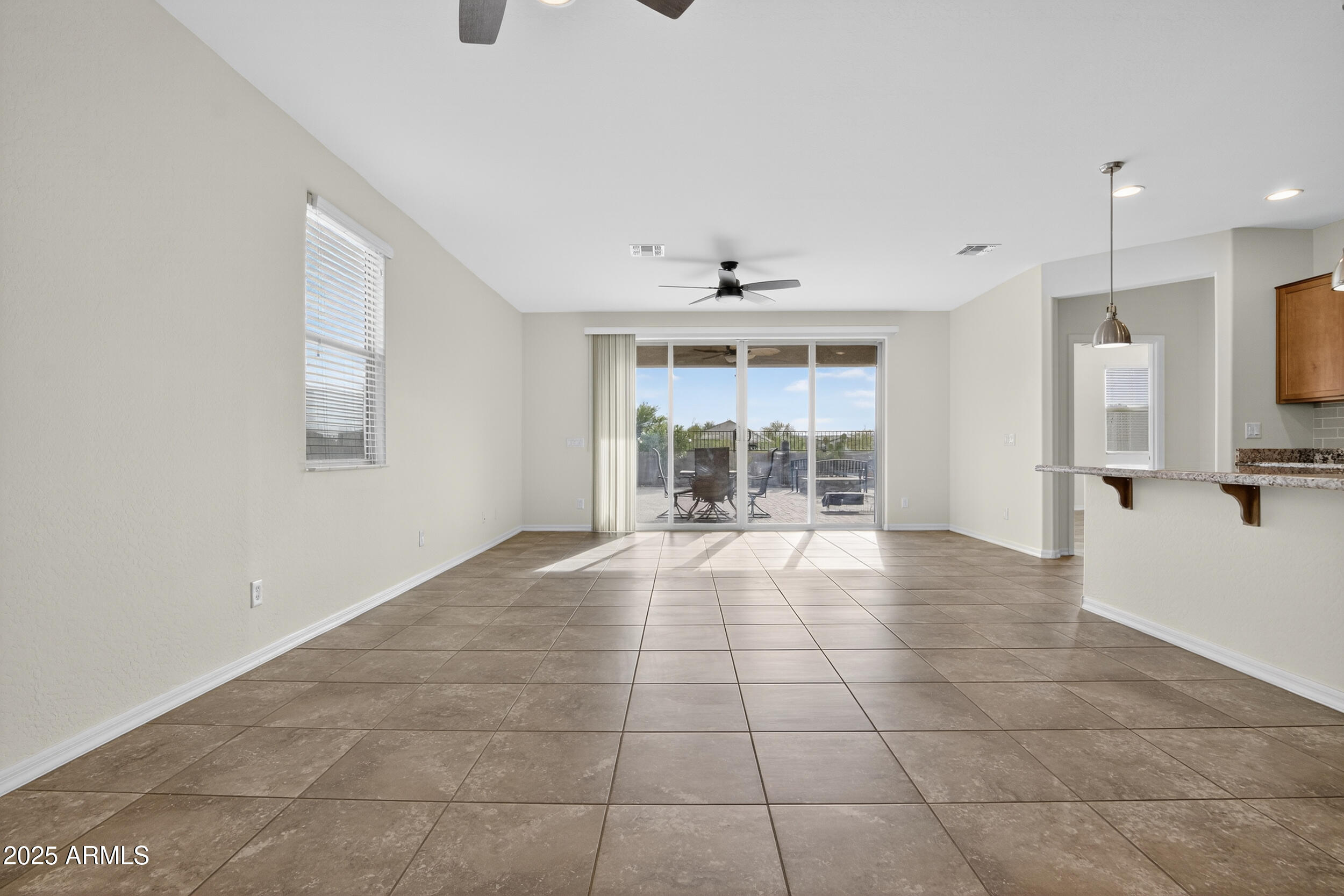 17763 West Granite View Drive Goodyear, AZ 85338 - Photo 14 of 67 a view of an empty room with a window