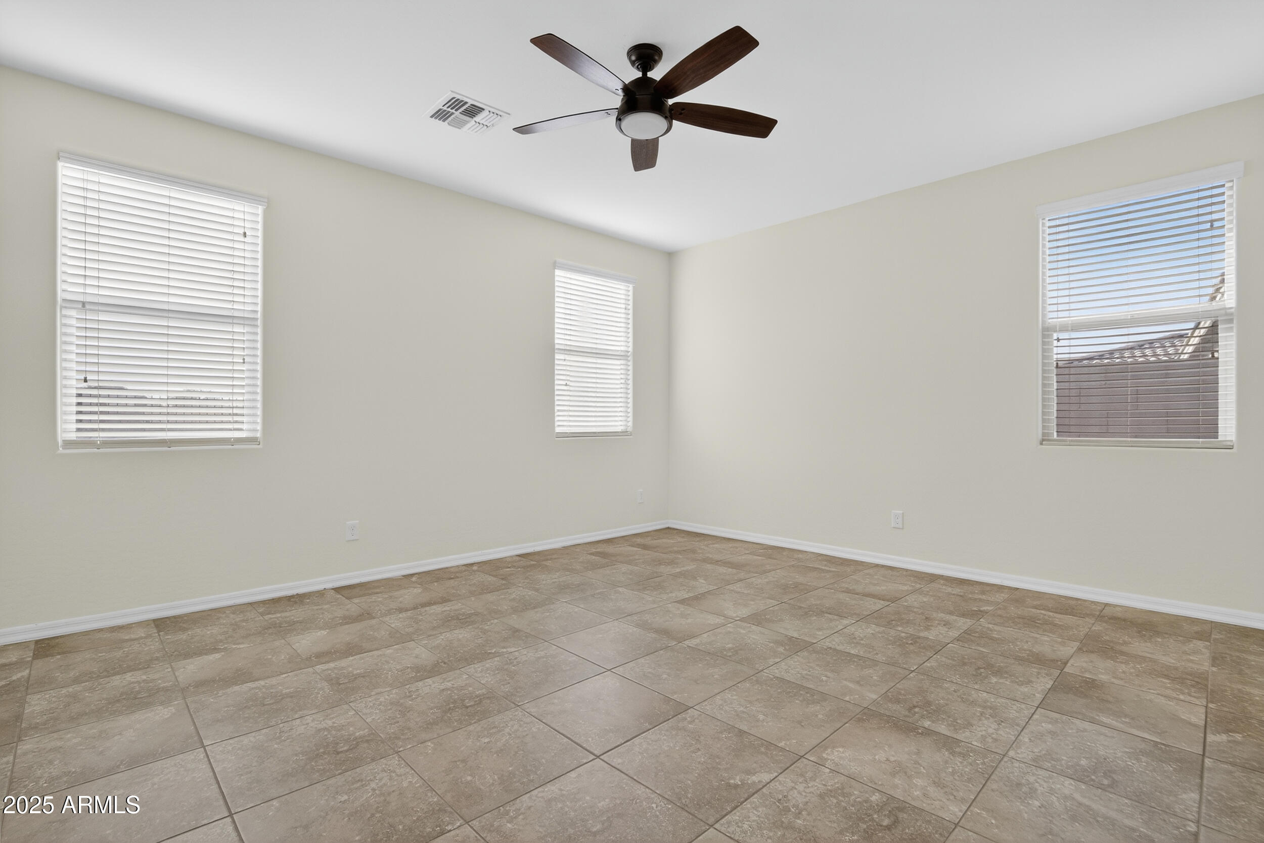 17763 West Granite View Drive Goodyear, AZ 85338 - Photo 19 of 67 a view of an empty room with a window