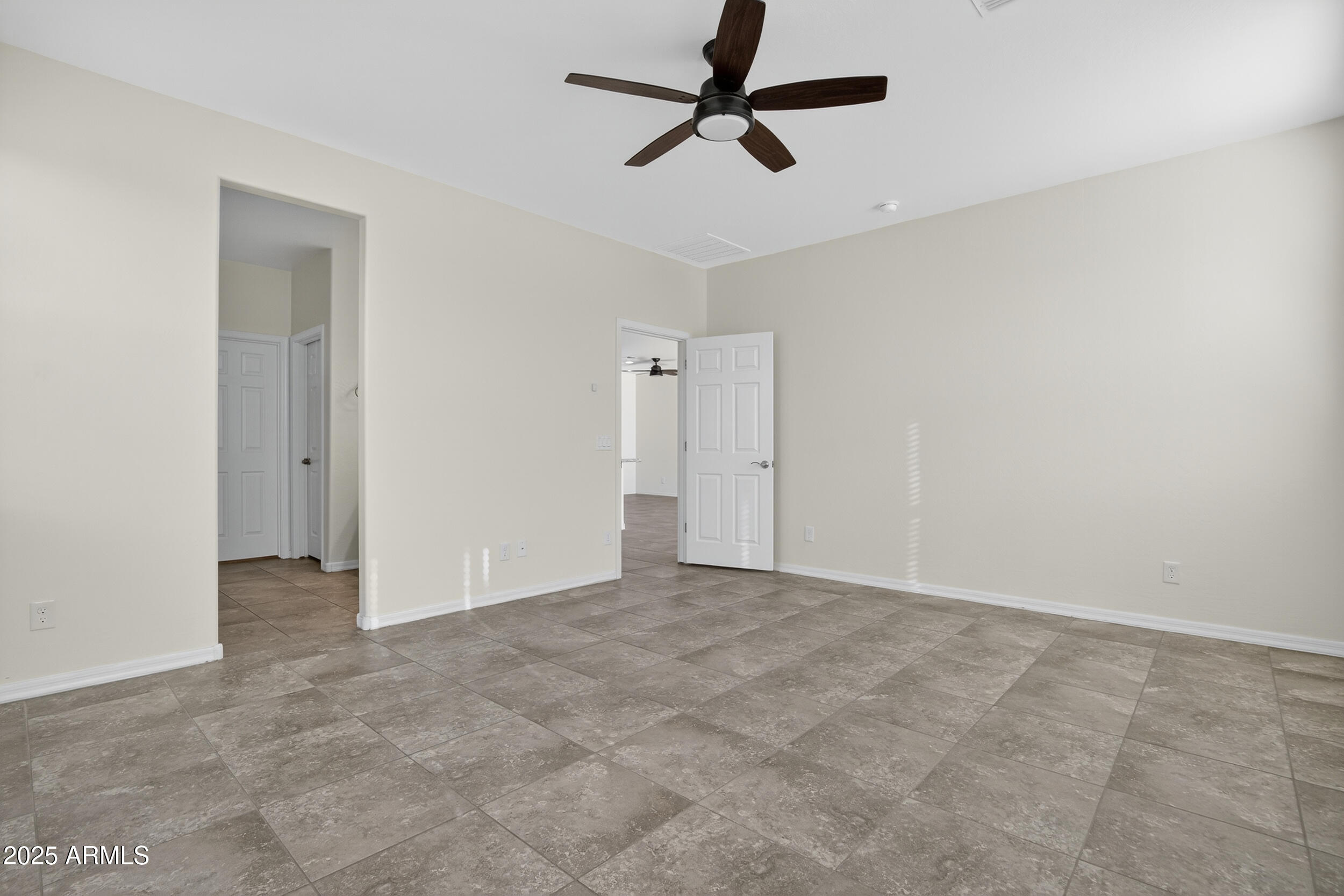 17763 West Granite View Drive Goodyear, AZ 85338 - Photo 20 of 67 an empty room with closet and a ceiling fan