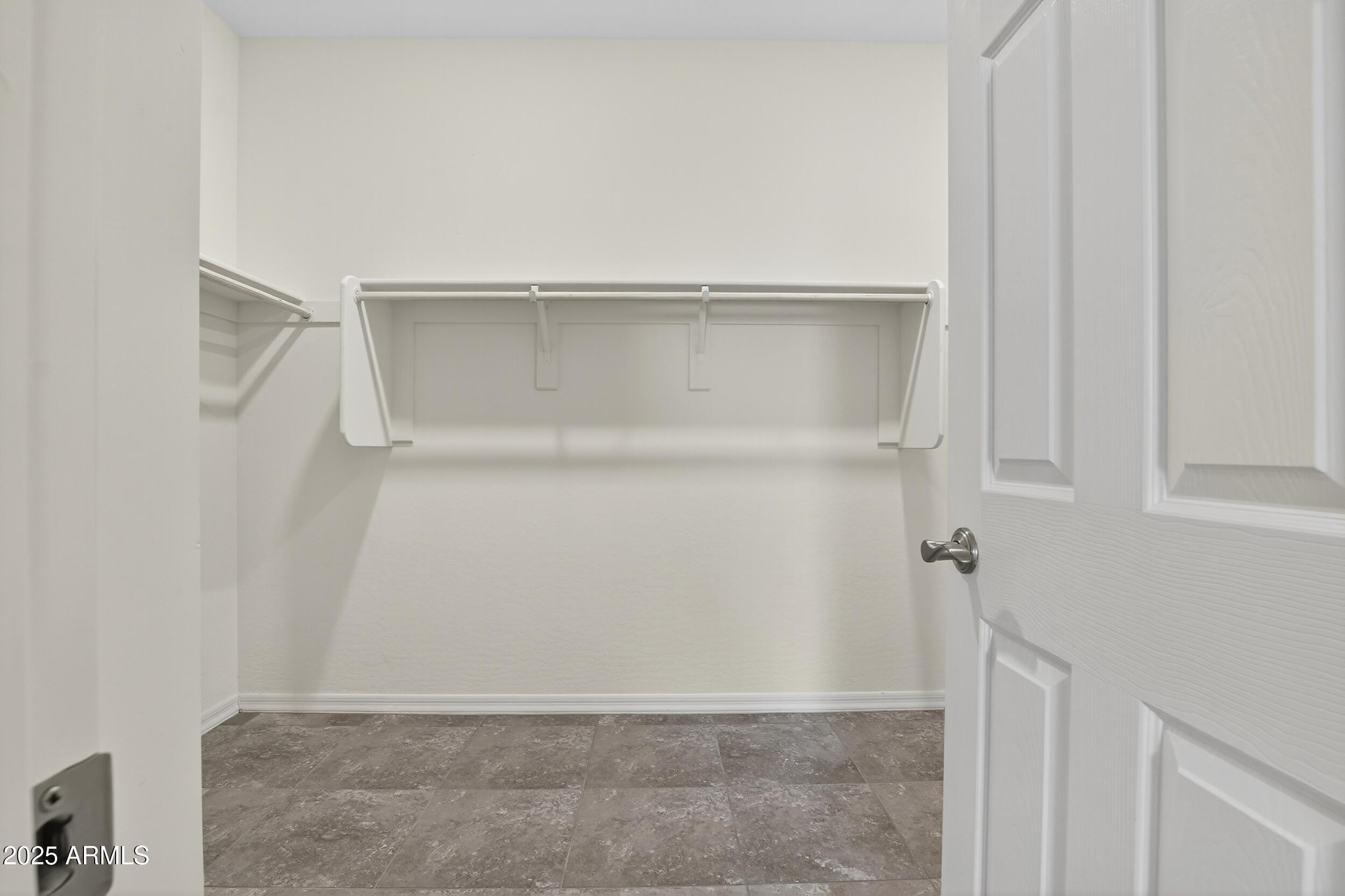 17763 West Granite View Drive Goodyear, AZ 85338 - Photo 27 of 67 a view of an empty walk in closet