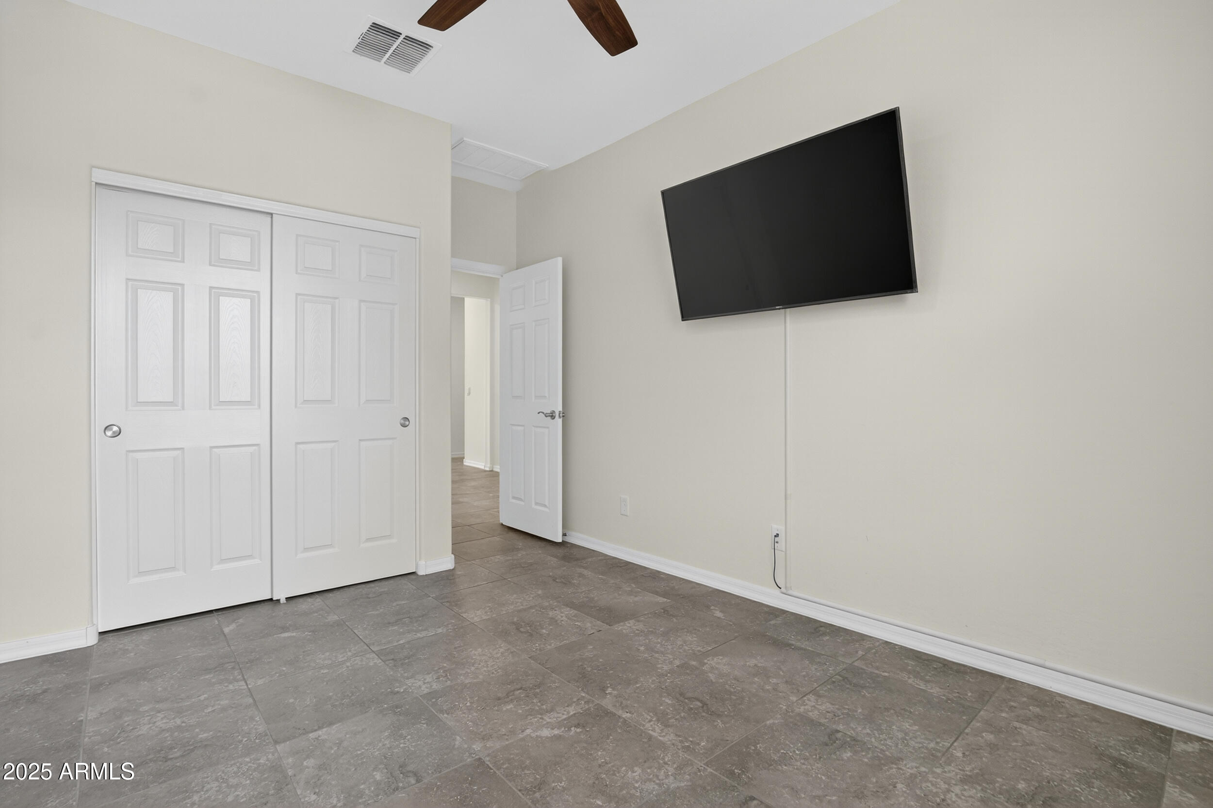 17763 West Granite View Drive Goodyear, AZ 85338 - Photo 31 of 67 a view of a livingroom with a flat screen tv