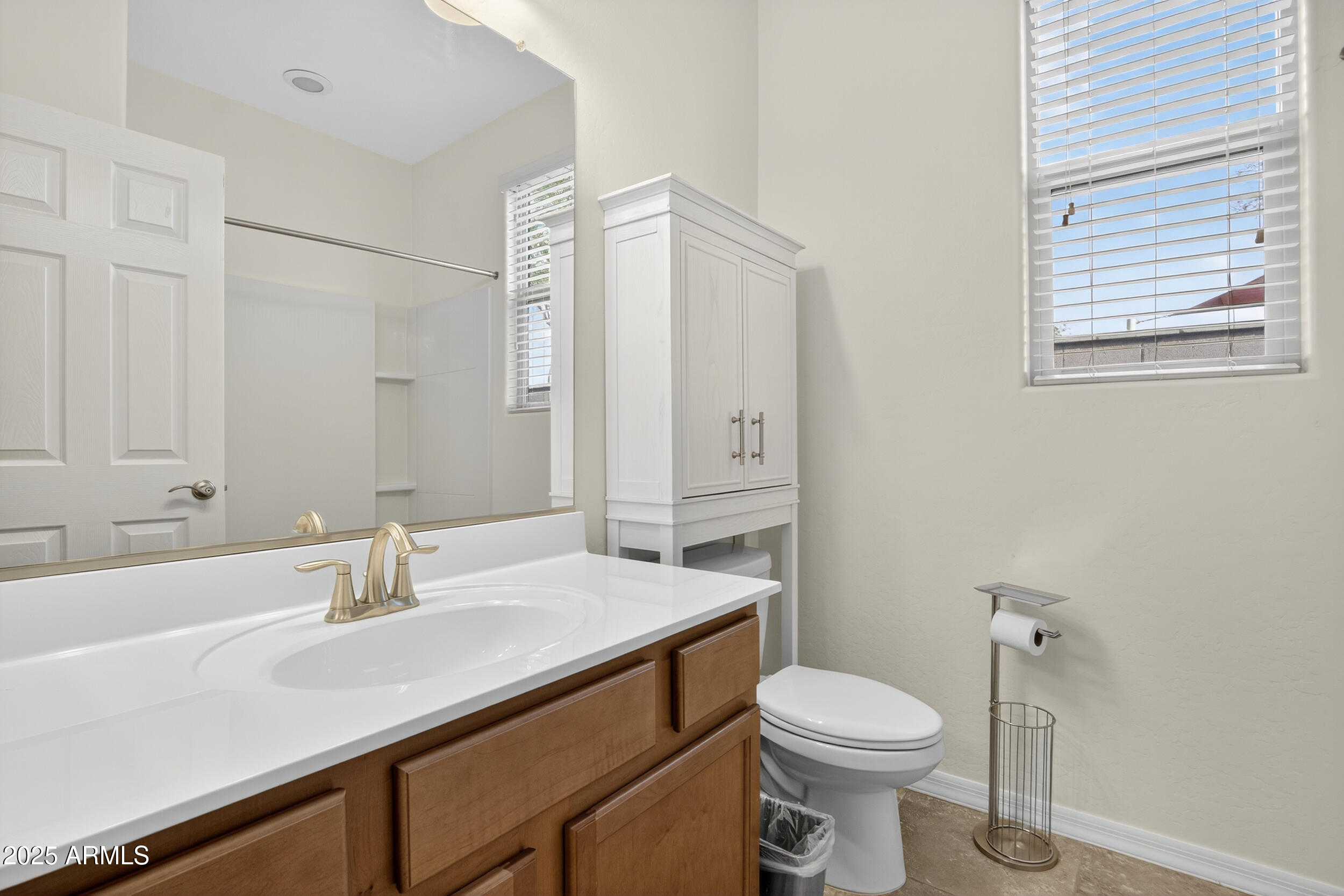 17763 West Granite View Drive Goodyear, AZ 85338 - Photo 32 of 67 a bathroom with a sink a toilet and shower