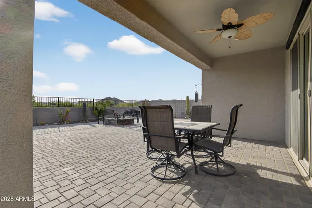 a living room with fireplace furniture and a chandelier