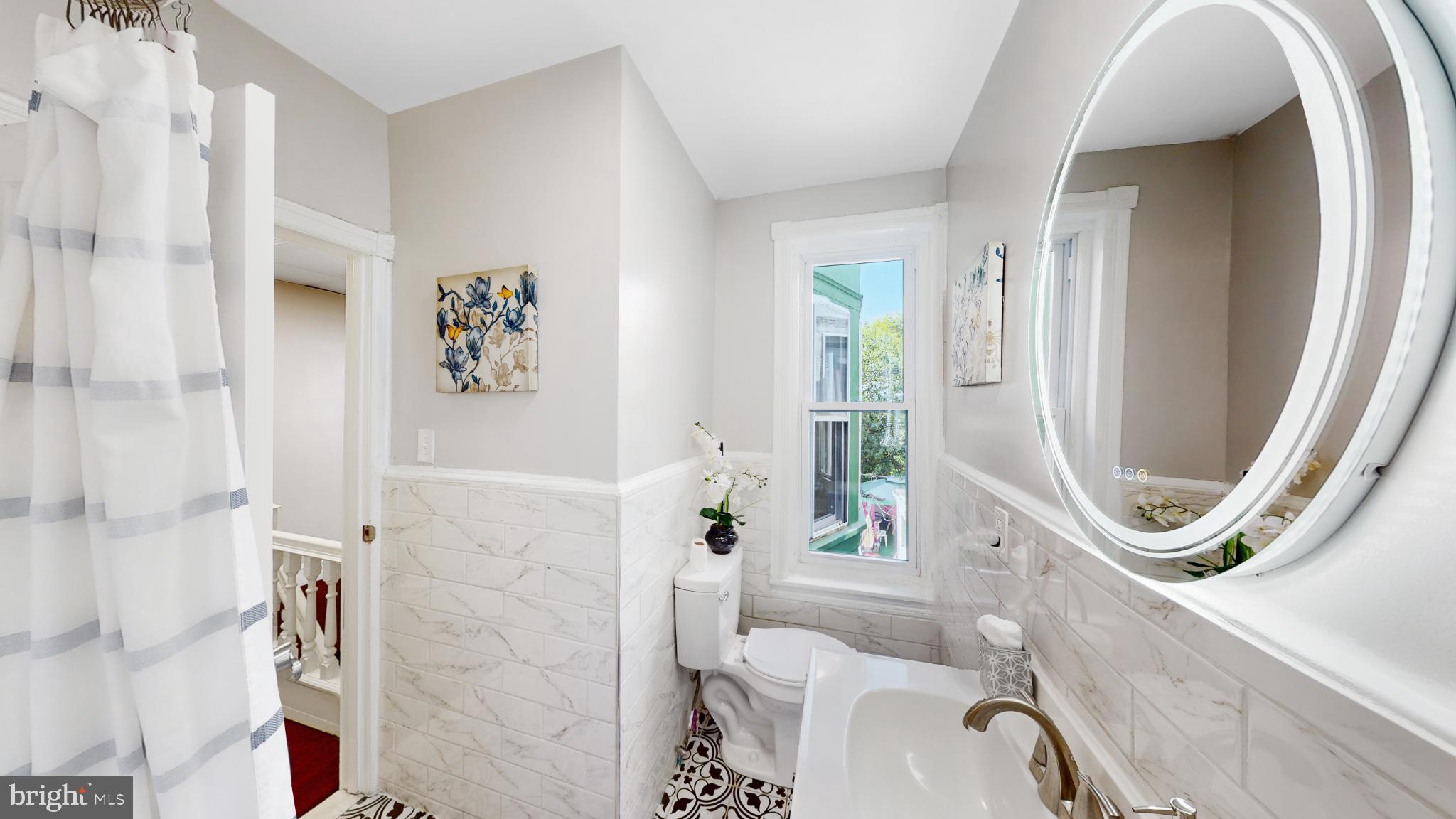 6038 Sansom Street Philadelphia, PA 19139 - Photo 16 of 22 Chic bathroom with modern elegance.