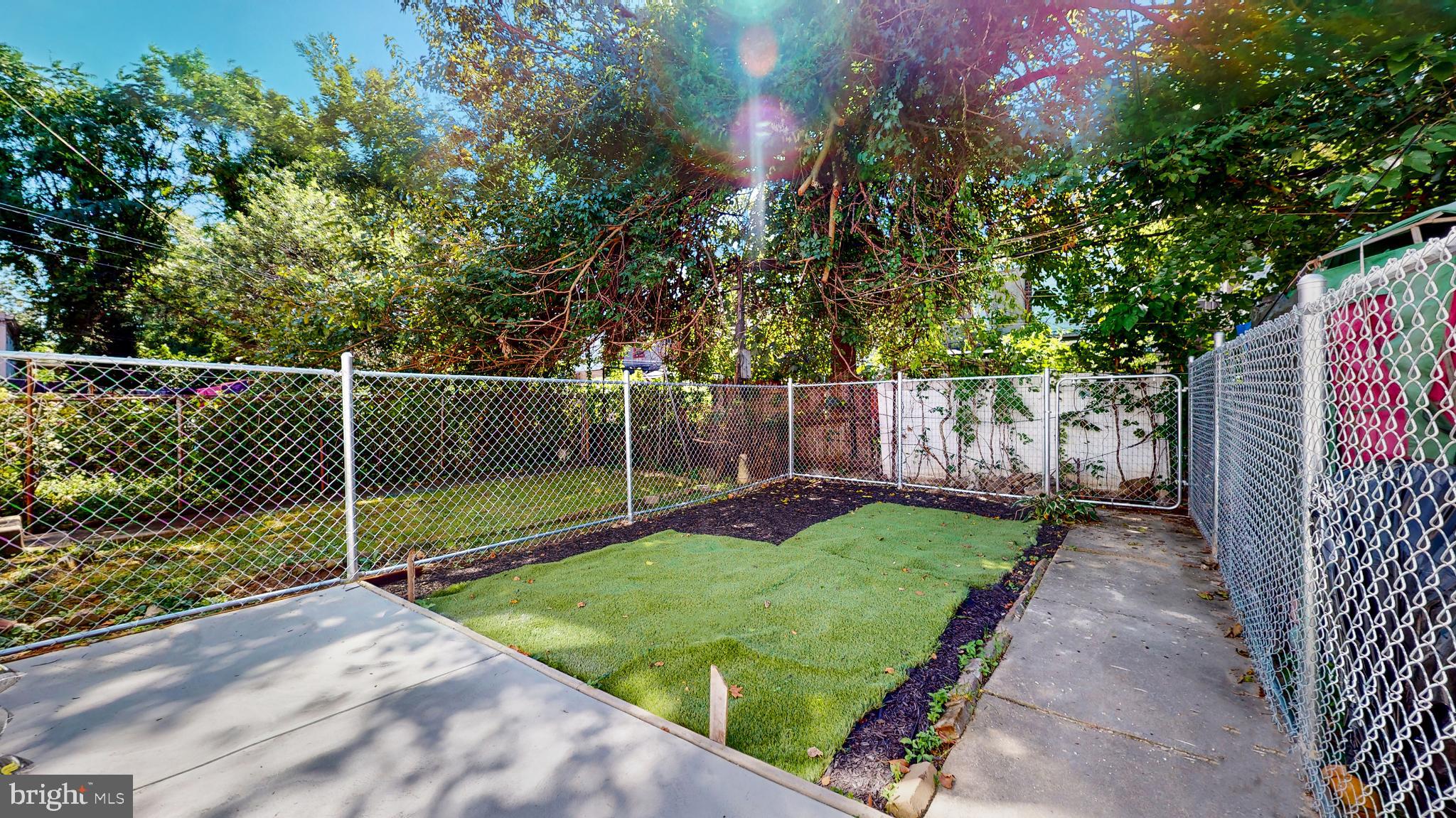 6038 Sansom Street Philadelphia, PA 19139 - Photo 20 of 22 Lush garden oasis with fenced serenity.