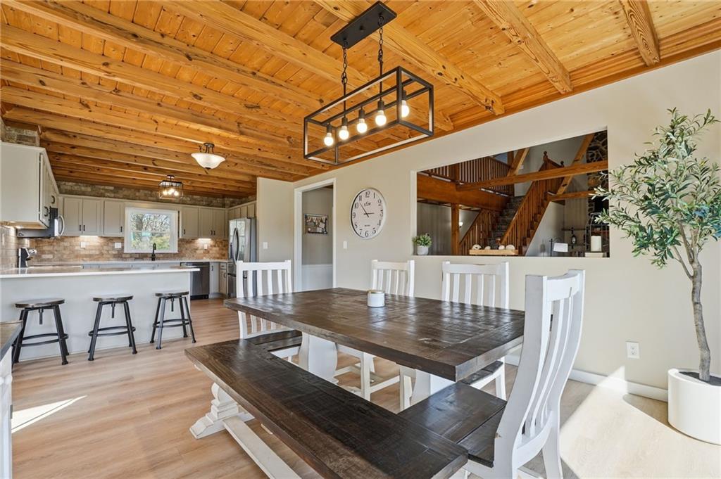 858 Honeysuckle Lane Temple, GA 30179 - Photo 20 of 60 a view of a dining room with furniture and wooden floor