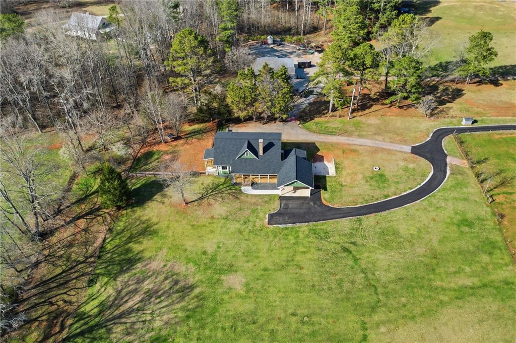 858 Honeysuckle Lane Temple, GA 30179 - Photo 56 of 60 an aerial view of a house with a swimming pool