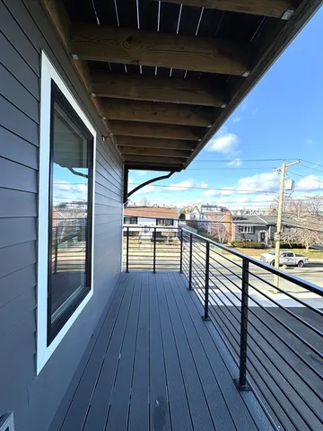 a view of outdoor space with wooden floor