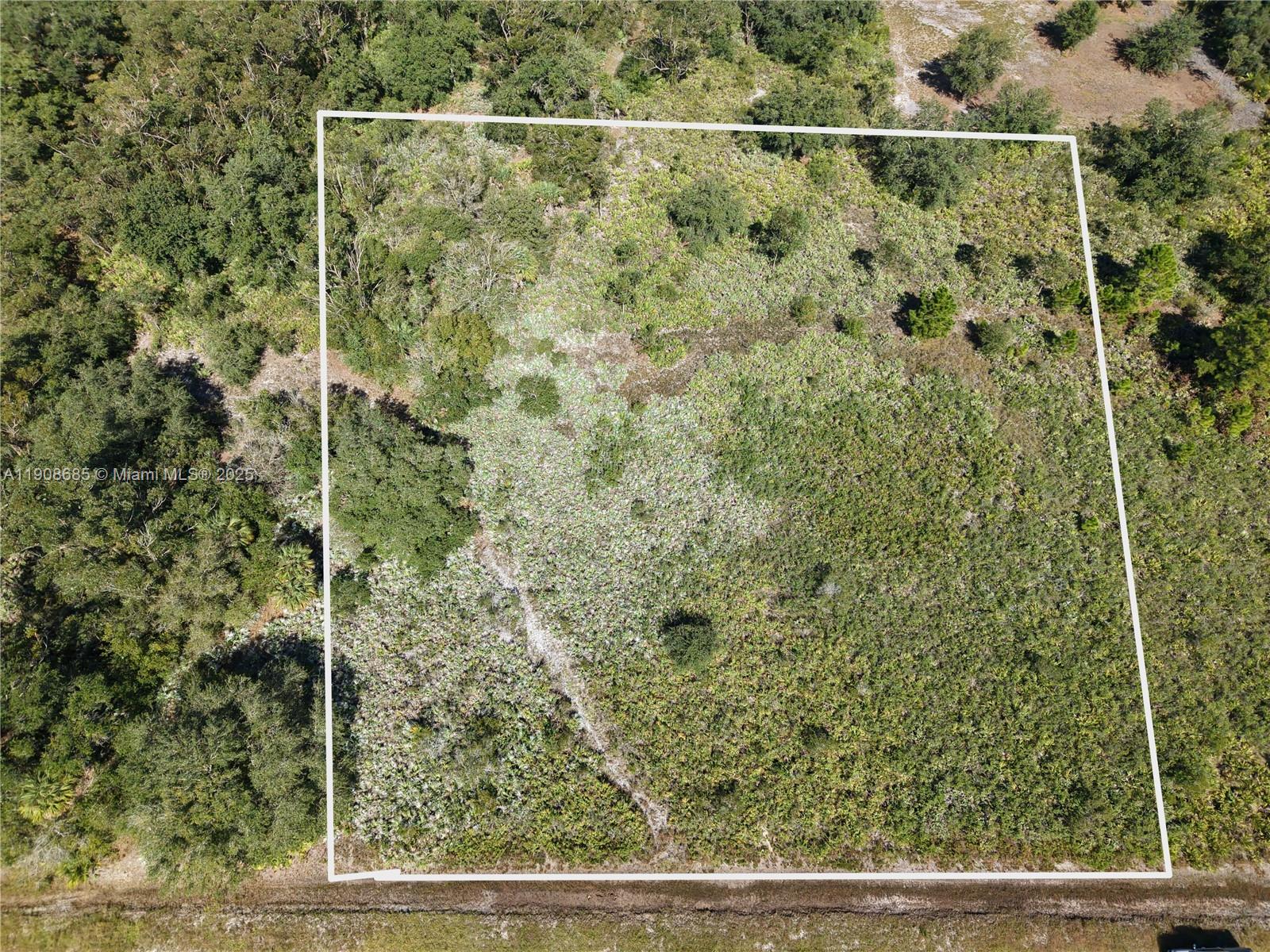 15527 Northwest 252nd Street Okeechobee, FL 34972 - Photo 2 of 32 a view of a door and chair