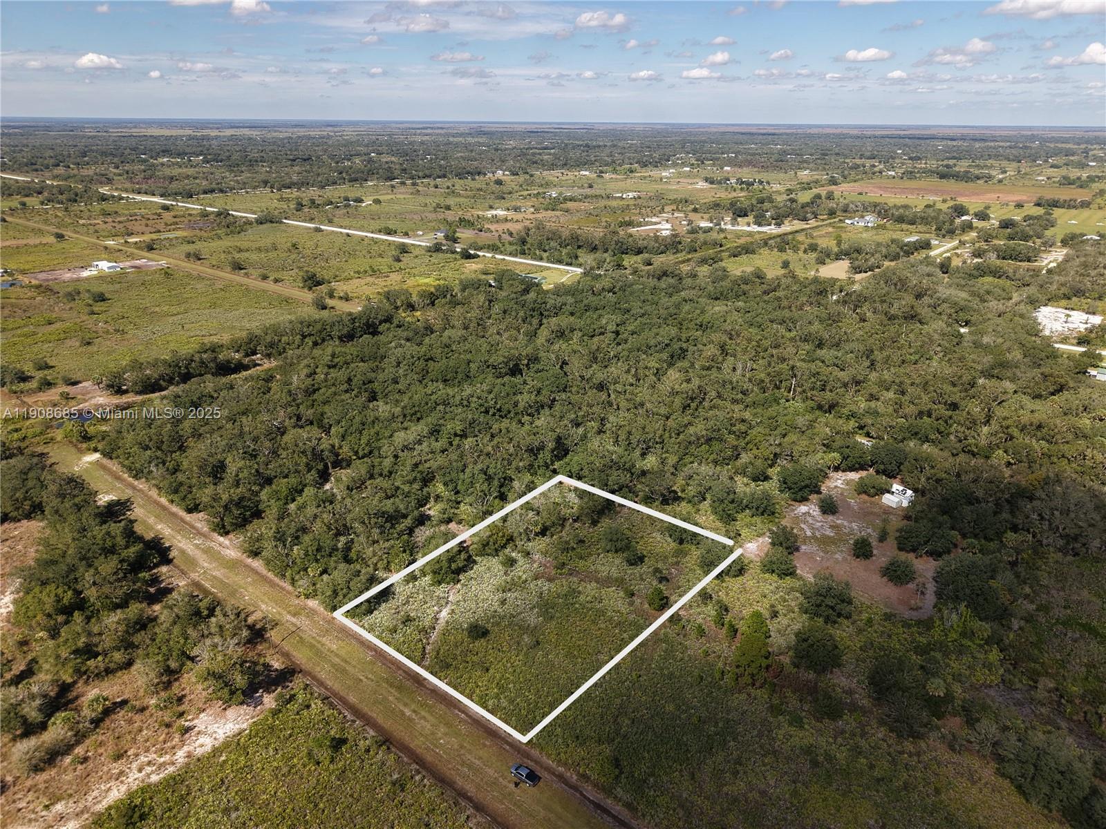 15527 Northwest 252nd Street Okeechobee, FL 34972 - Photo 31 of 32 a view of an outdoor space and a lake view