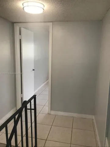 a view of hallway with stairs