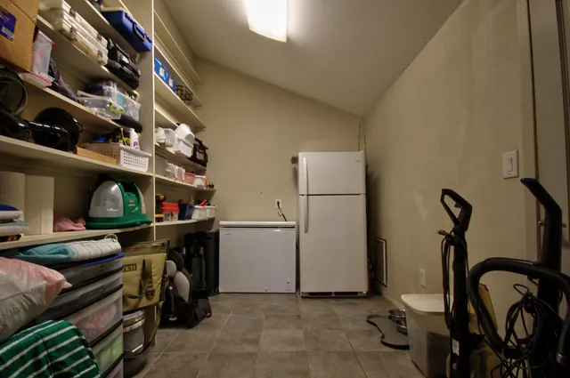 an aerial view of residential house with outdoor space and swimming pool