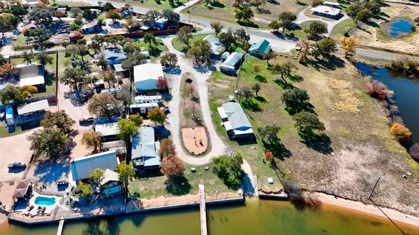 an aerial view of a house with yard swimming pool and outdoor seating
