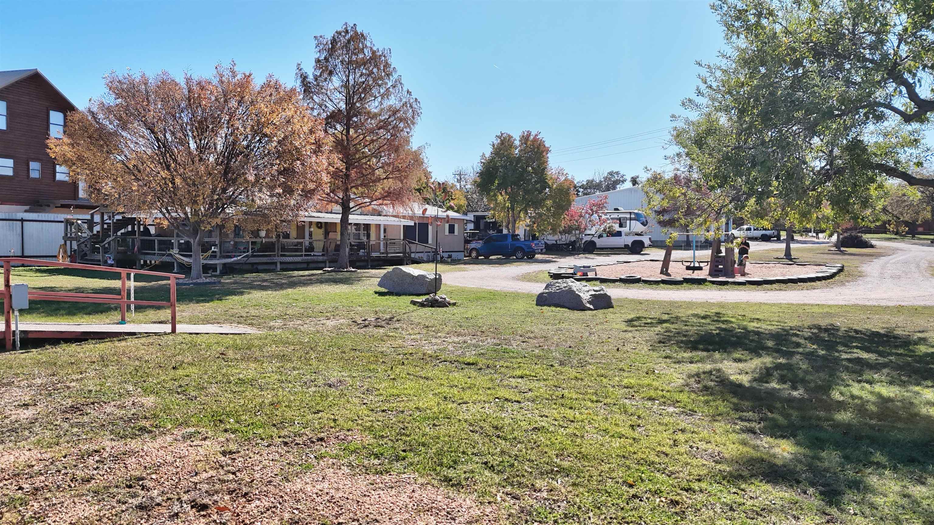 1504 Rr 261 - Main Home Buchanan Dam Buchanan Dam, TX 78609 - Photo 23 of 30 a view of a house with a yard patio and fire pit