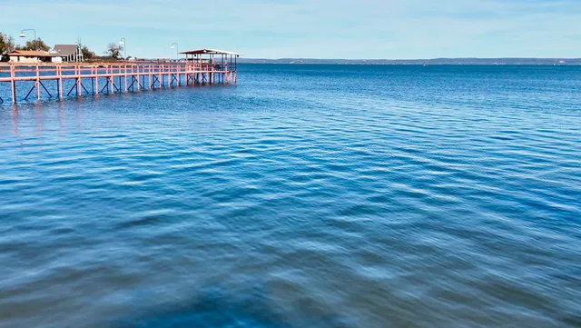 a view of chairs and umbrella in the patio