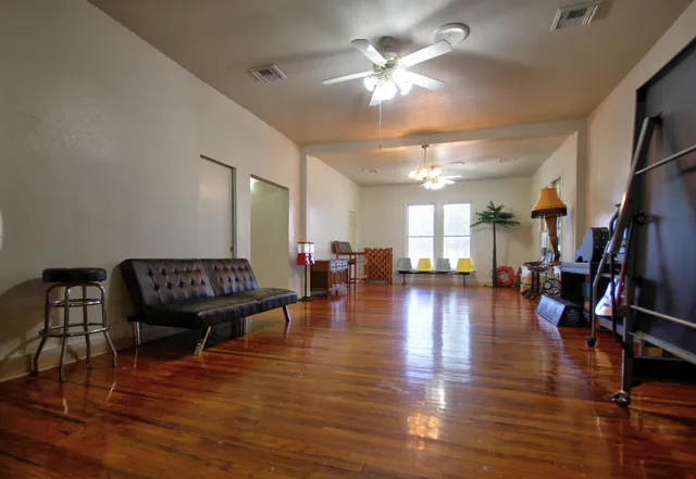 a view of a livingroom with furniture and a chandelier