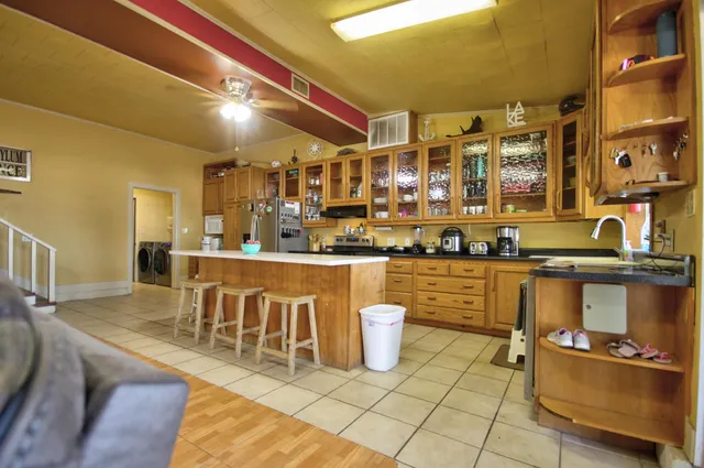 a dining table with chairs and chandelier
