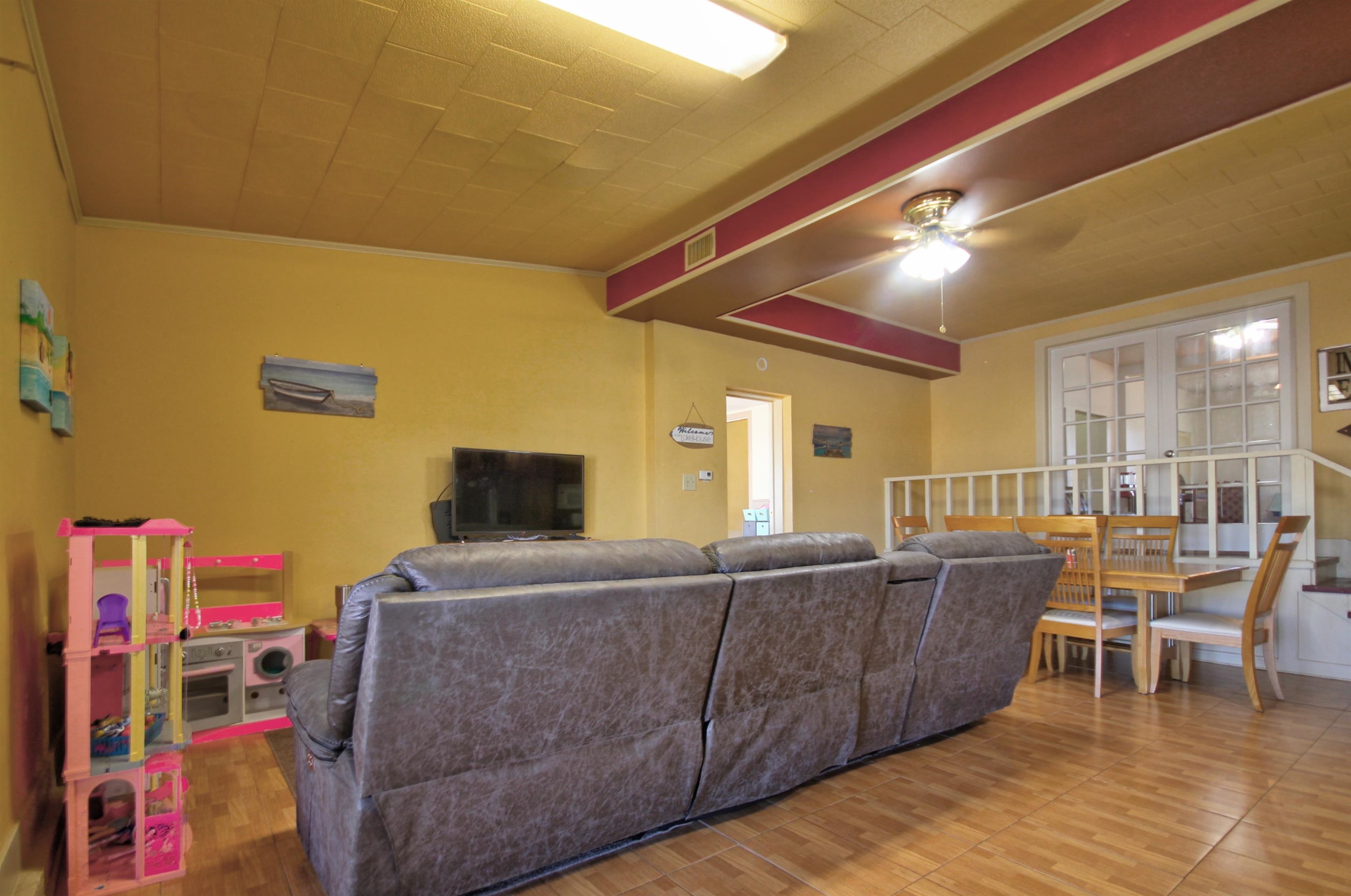 1504 Rr 261 - Main Home Buchanan Dam Buchanan Dam, TX 78609 - Photo 9 of 30 a living room with furniture and a flat screen tv