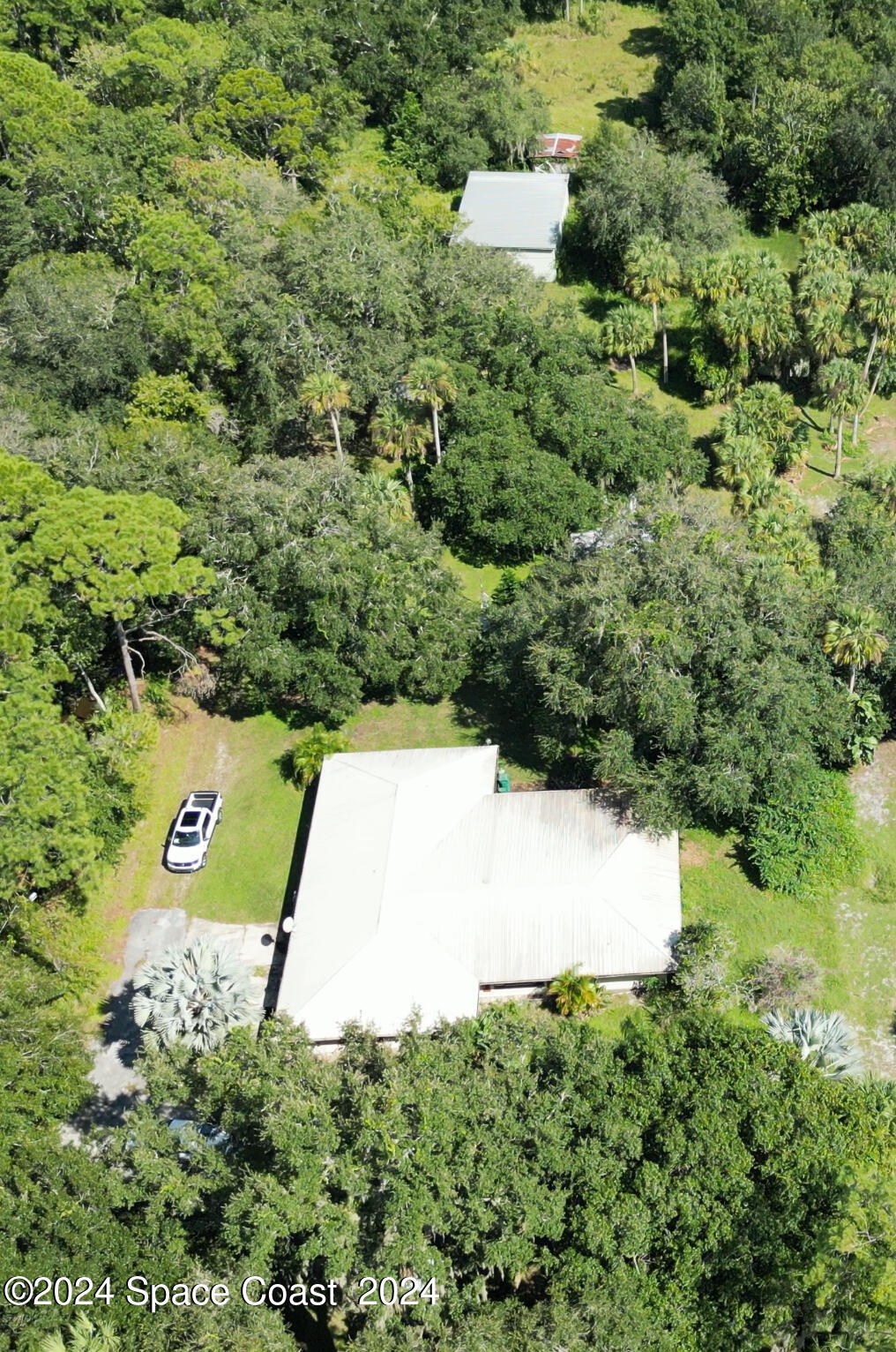 2293 Cox Road Cocoa, FL 32926 - Photo 18 of 18 an aerial view of a house with a yard