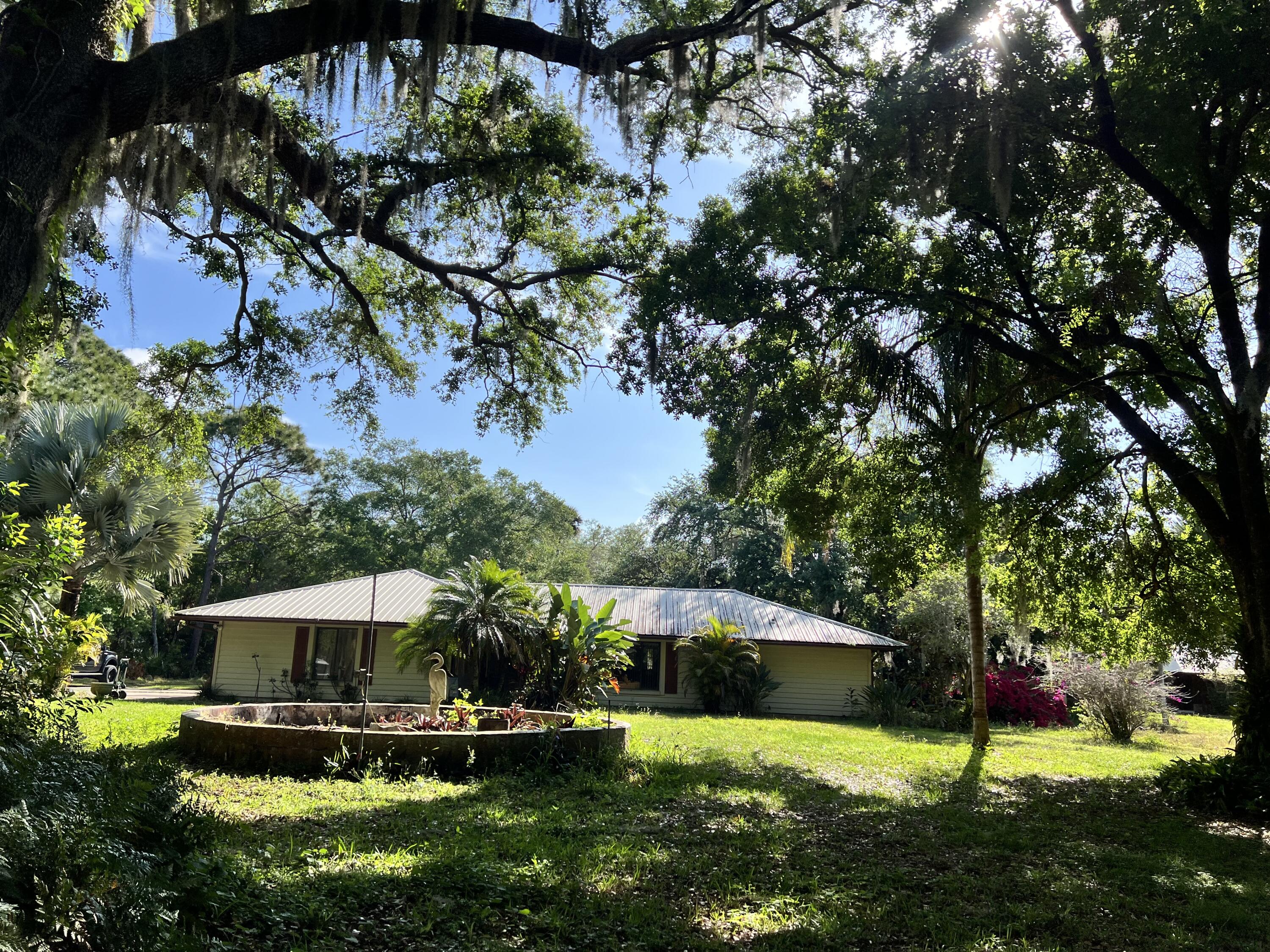 2293 Cox Road Cocoa, FL 32926 - Photo 2 of 18 a view of a house with a yard balcony and sitting area