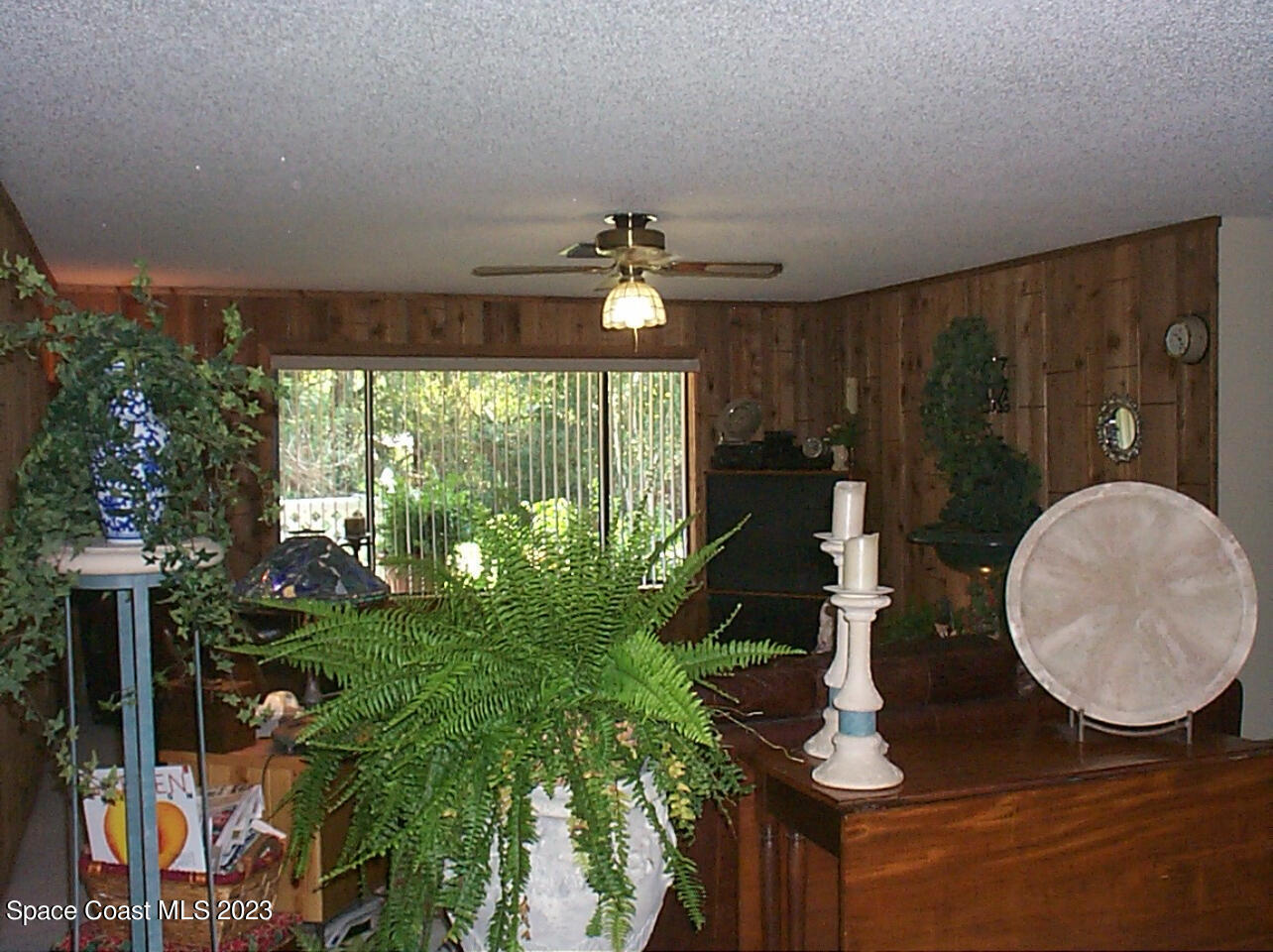 2293 Cox Road Cocoa, FL 32926 - Photo 10 of 18 a living room with furniture and a large window