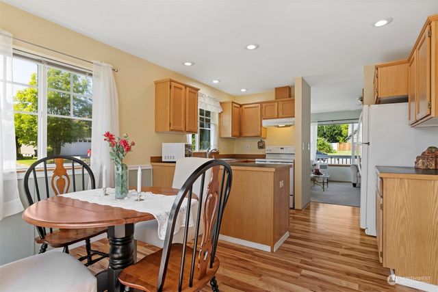 a view of a dining room with furniture window and outside view