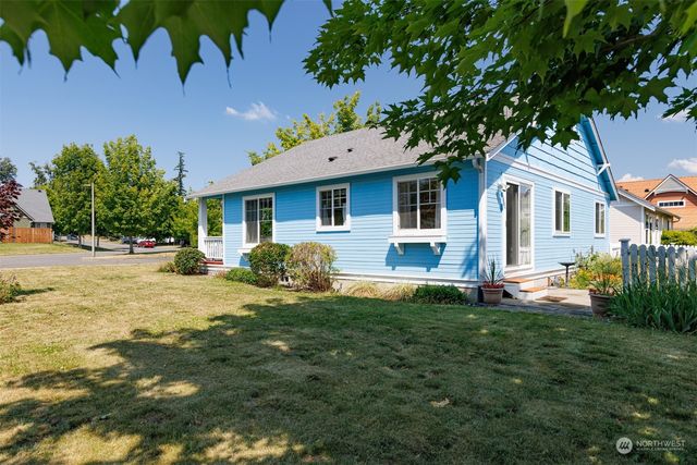 a view of backyard with a patio and a garden