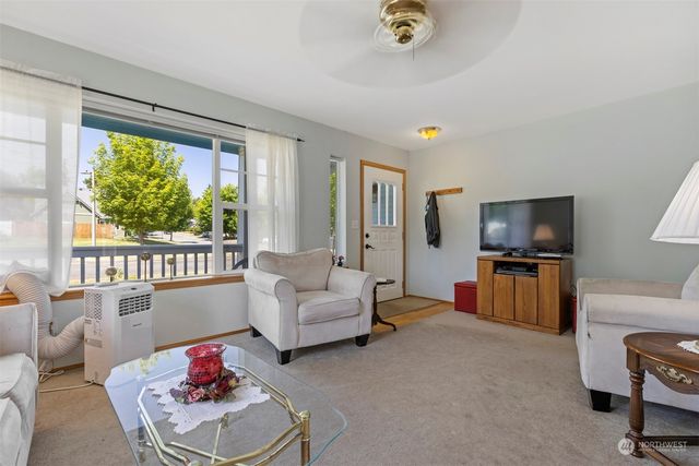 a living room with furniture and a window