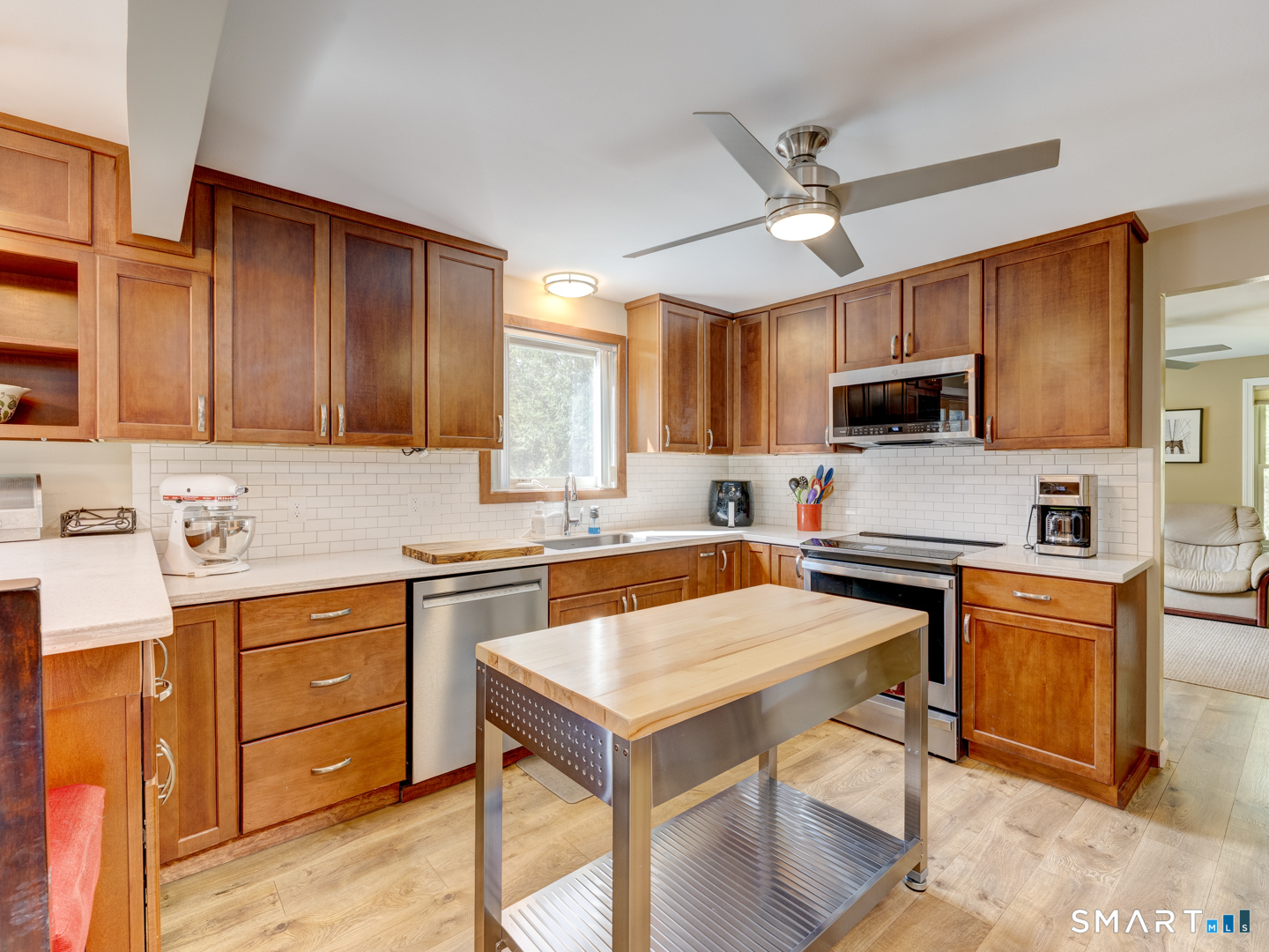 97 Lair Road New Hartford, CT 06057 - Photo 14 of 39 a kitchen with a stove a sink and a refrigerator