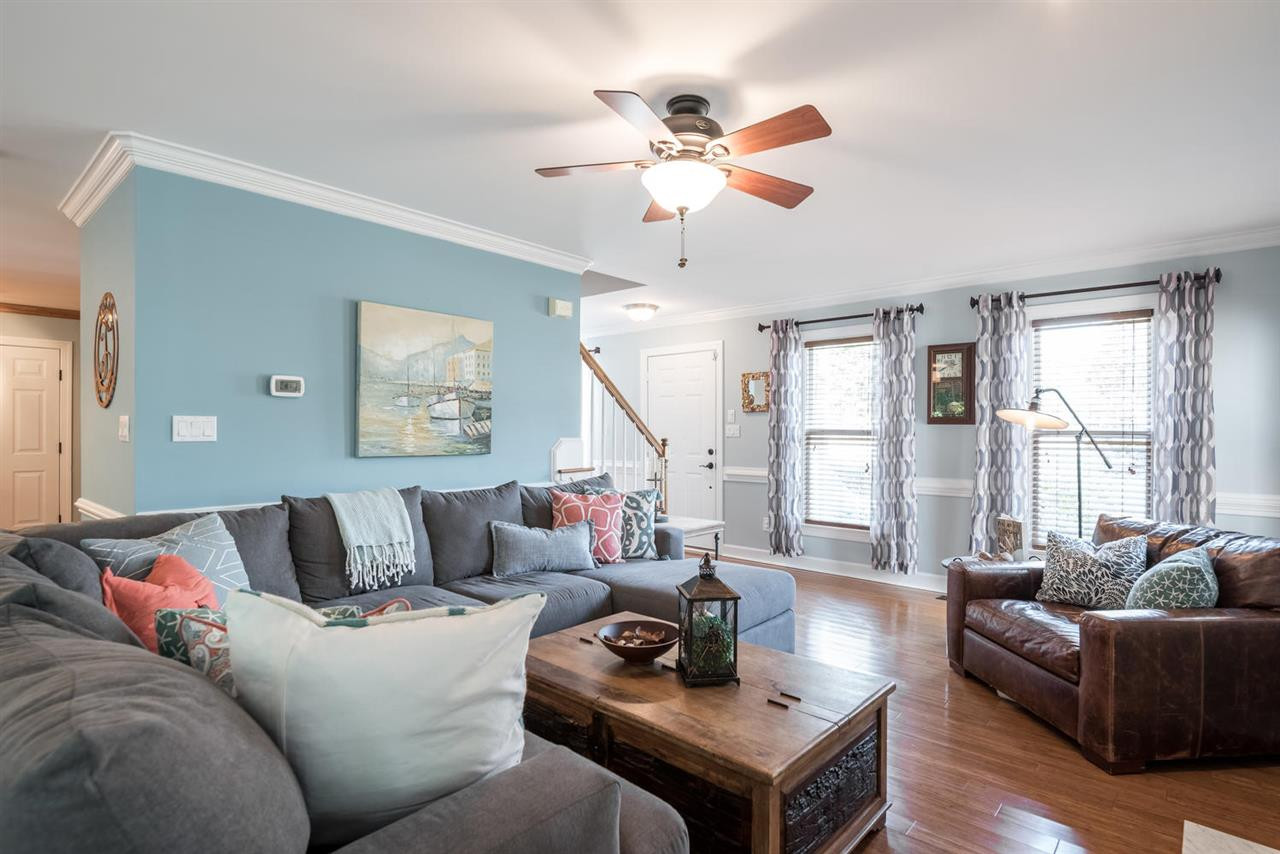 Great space. View towards the entry way. Blinds and curtains stay with the house. Living Room