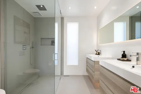 a bathroom with a bathtub a sink a toilet and a shower