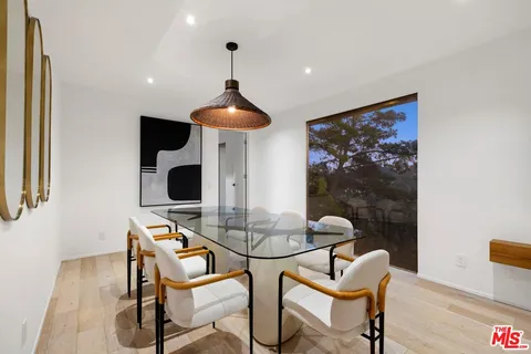 a table and chairs in a room with a table and chairs