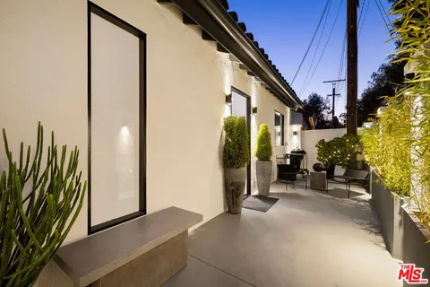 a view of a chairs and table in the patio